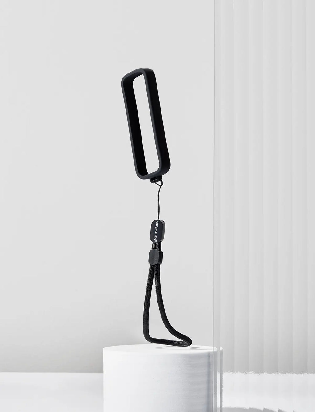 Strap-on-Me remote control attachment designed for secure fastening and convenient hands-free use