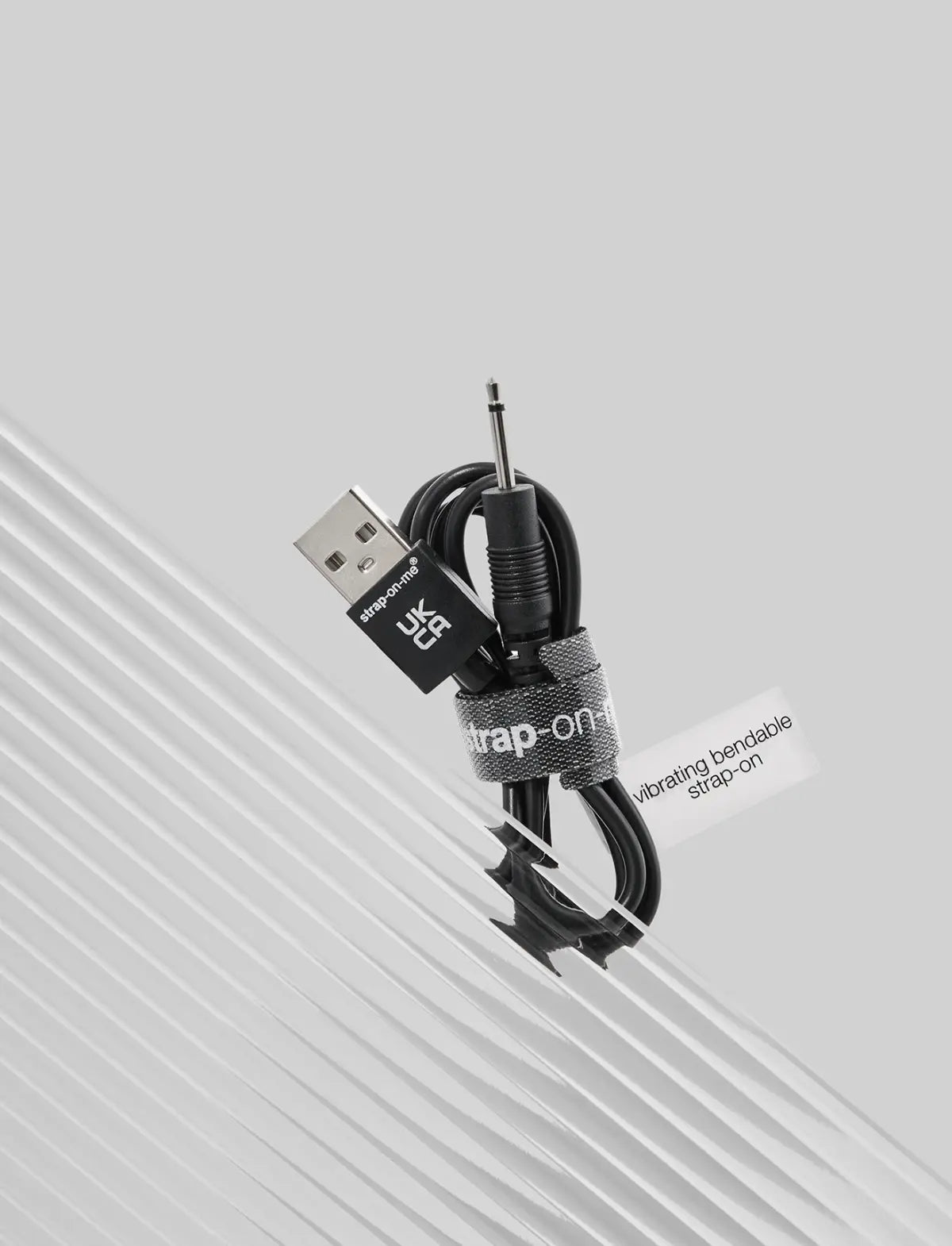 Strap-on-Me USB charger designed for rechargeable devices with multi-motor compatibility and easy charging convenience