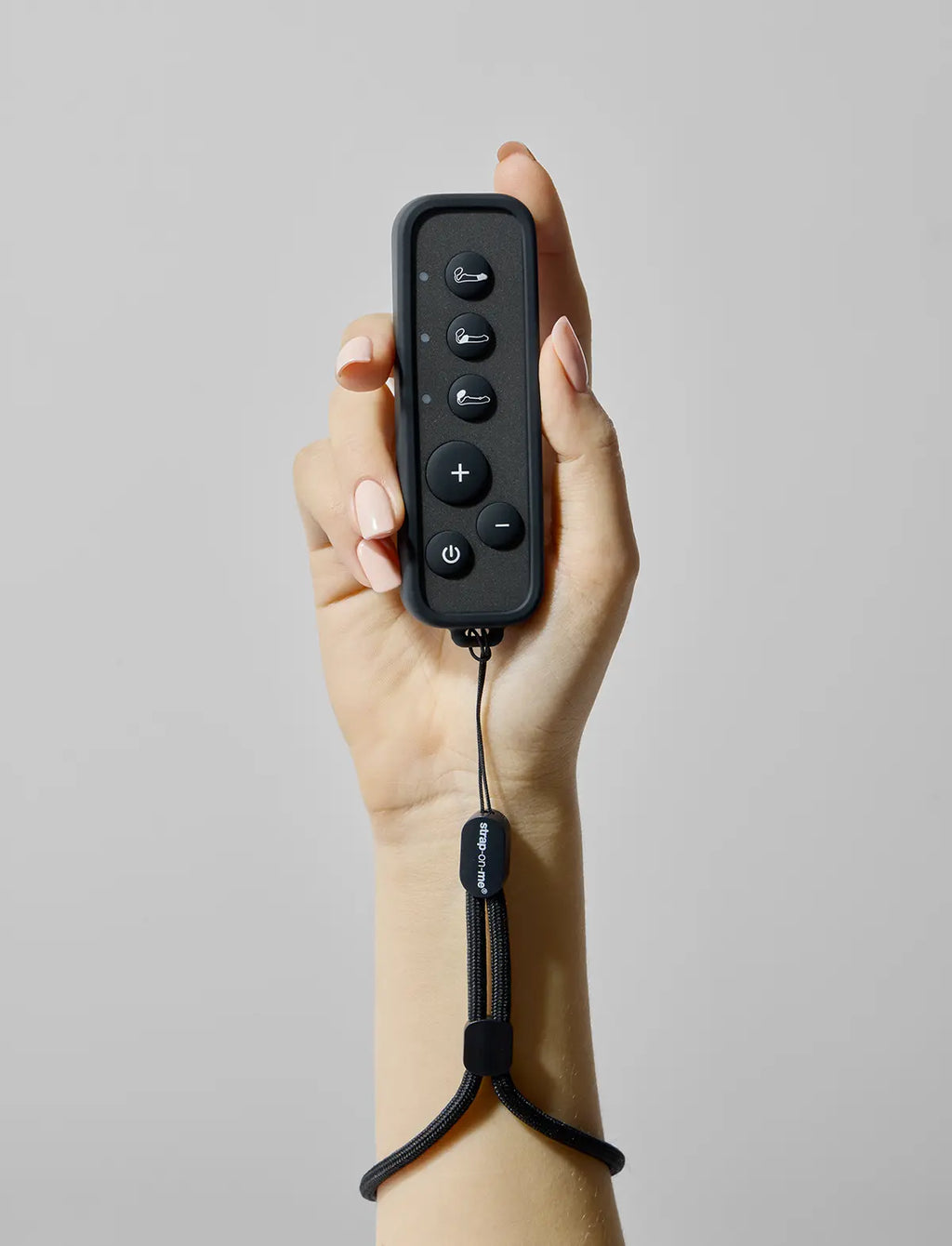 Strap-on-Me remote control attachment designed for secure fastening and convenient hands-free use