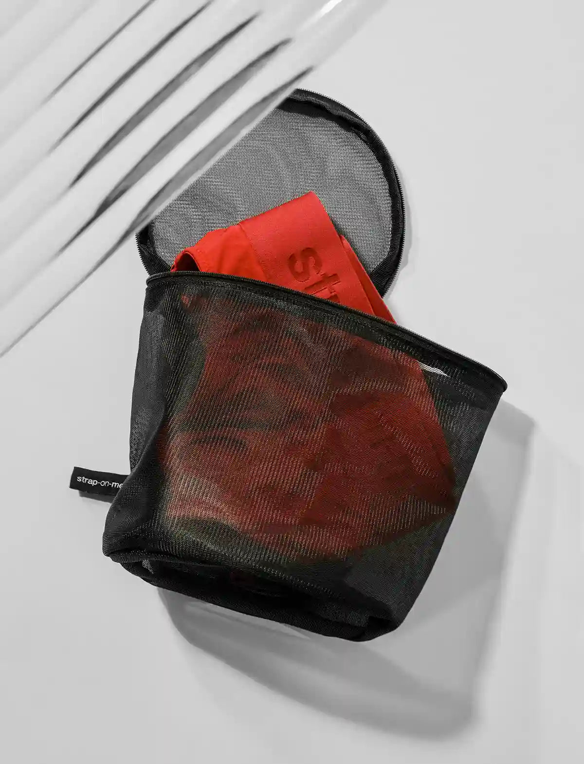 Strap-on-Me wash pouch designed for storing and protecting products while keeping them clean and discreet