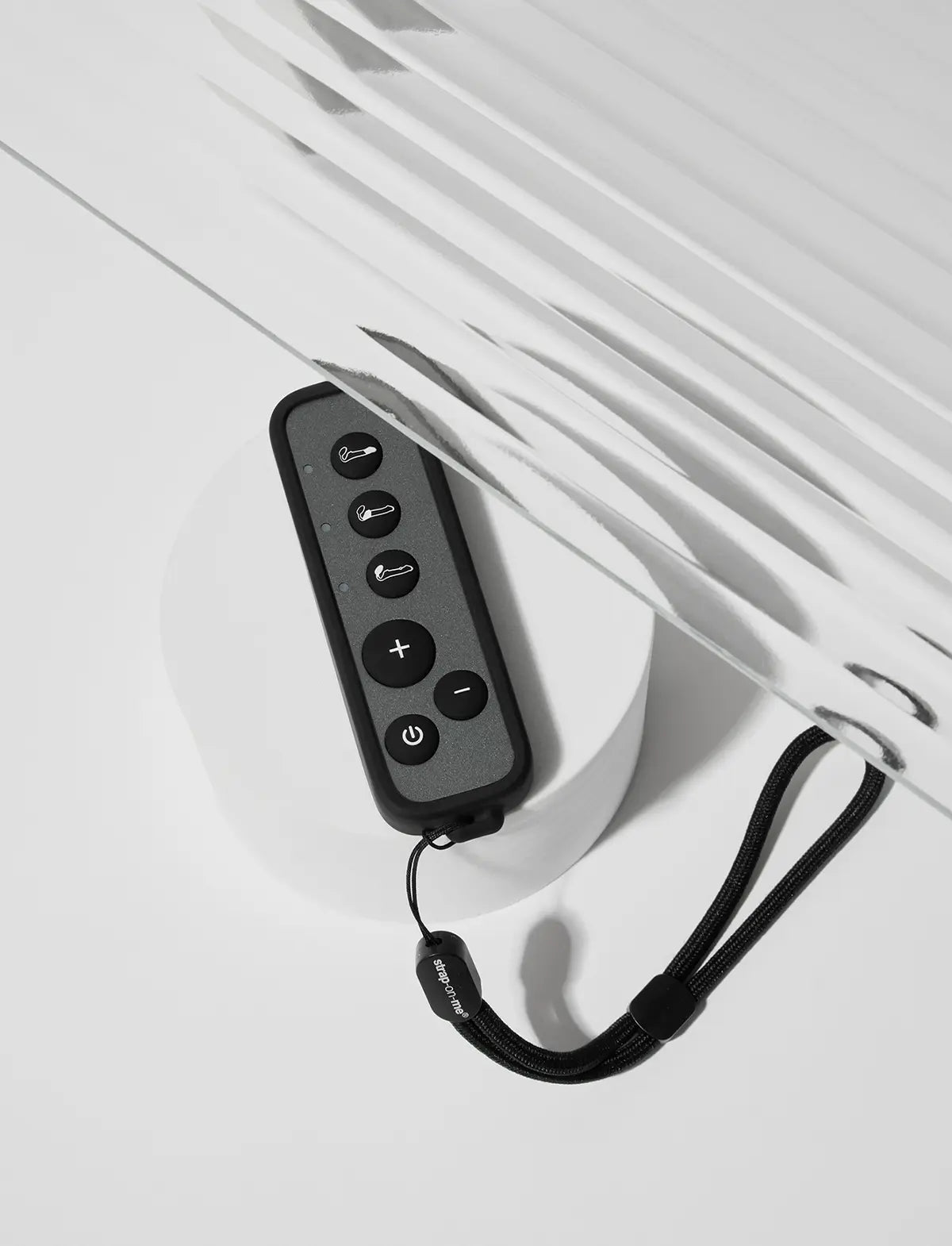 Strap-on-Me remote control attachment designed for secure fastening and convenient hands-free use