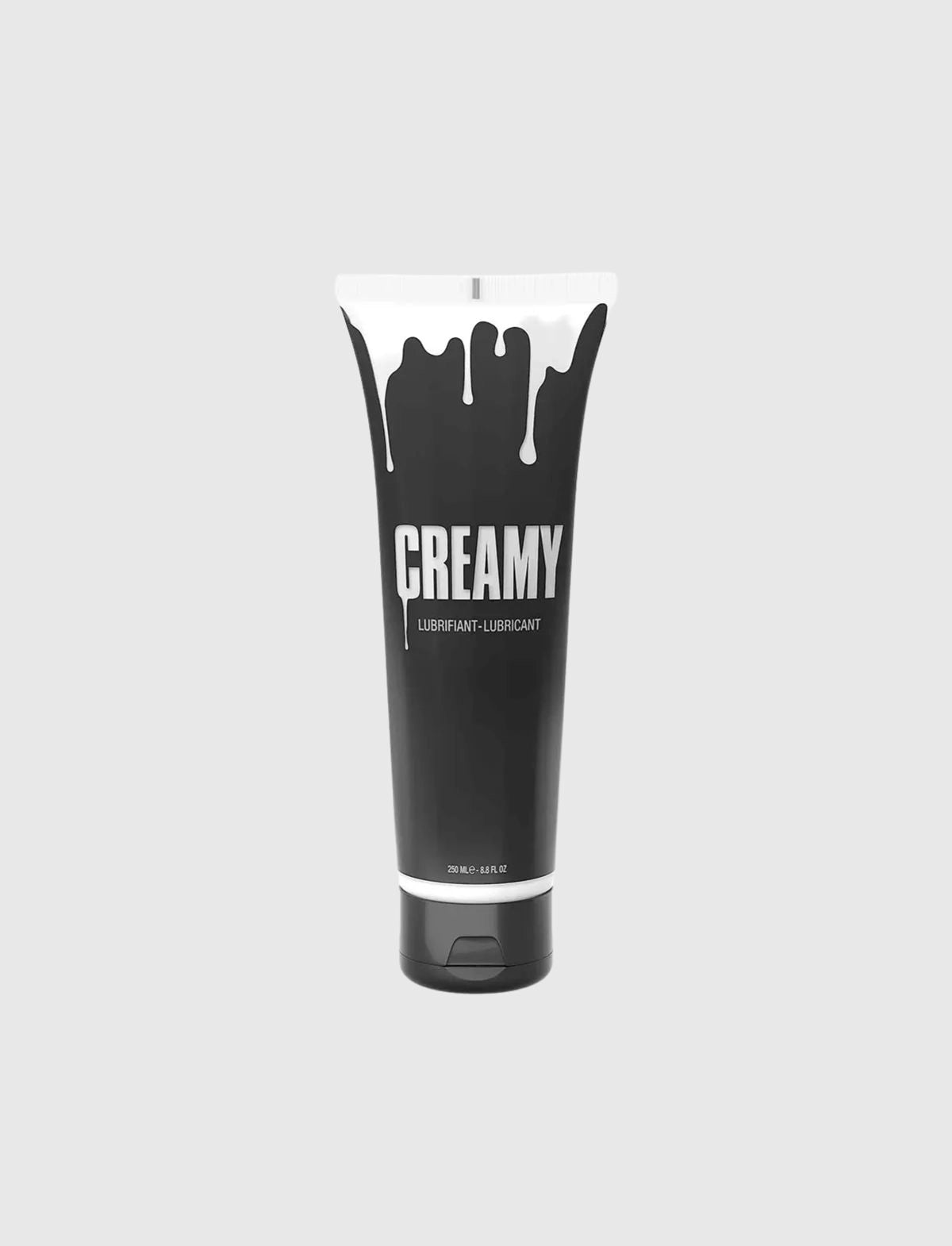 Black tube of 'Creamy' fake cum lubricant product with white cap on a light gray background