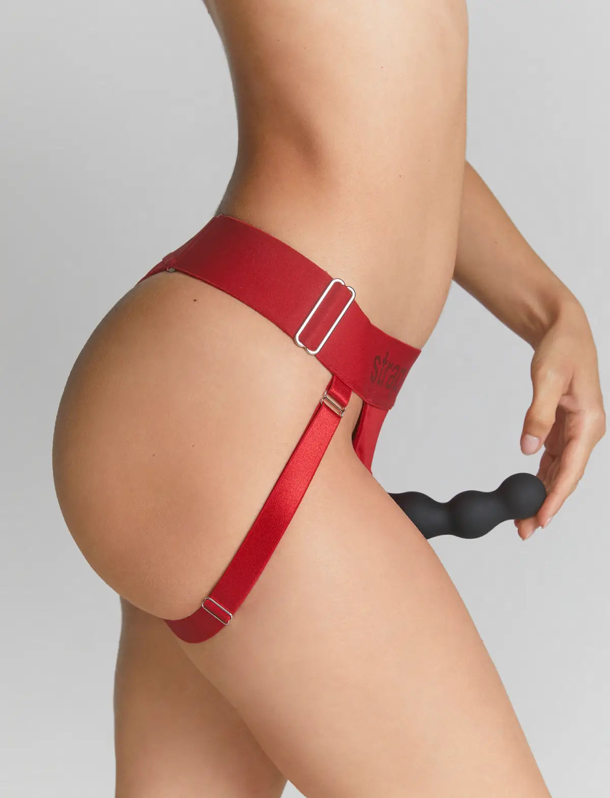 Unique red lingerie harness Strap-on-Me with adjustable fit and minimalist design for comfortable and elegant wear