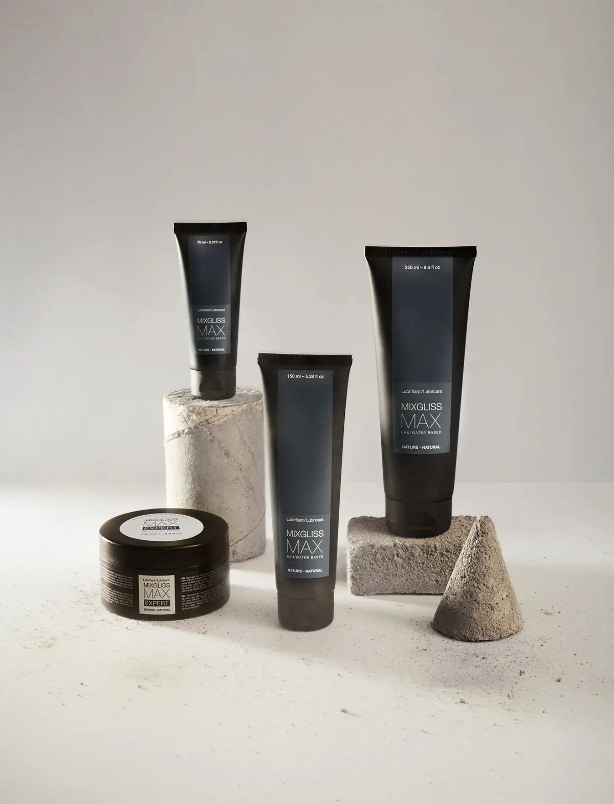 Set of Mixgliss anal lubricants on a neutral background